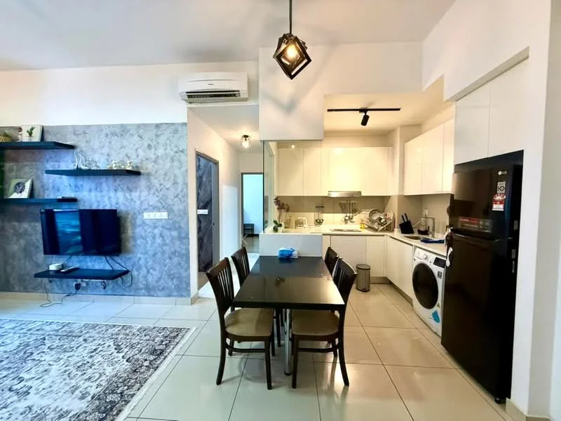 Kitchen features: white cabinetry, black refrigerator, built-in oven, stainless-steel sink, chrome pull-down faucet, ceramic tile flooring, recessed downlights, kitchen island, washing machine, microwave, open shelving, grey accent wall; style: modern. Dining features: 6-seater dining table, wooden dining chairs, decorative pendant light, area rug, wall-mounted TV, shelf unit, white walls; style: modern.