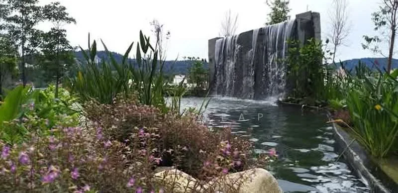 Exterior type: landscape garden; features: waterfall feature, pond with water plants, tropical landscaping, mature trees, flowering plants, rock formations, pathway, lush greenery; style: tropical-modern.