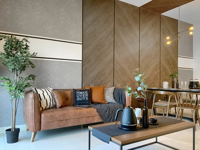 Living features: brown leather sofa, black and white decorative pillows, wooden coffee table, black kettle, black vase, green potted plant, grey accent wall, wood paneling, pendant light fixture, dining table with chairs in background, decorative throw blanket; style: modern.