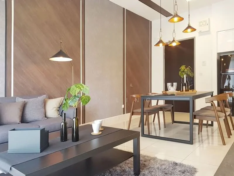 Living features: grey fabric sofa, decorative cushions, black coffee table, area rug with soft texture, pendant lighting with multiple bulbs, wooden accent wall, white painted walls, floor-to-ceiling windows, indoor plant in ceramic pot; style: modern. Dining features: black dining table, wooden dining chairs, glass vase with flowers, tableware including glasses, pendant lights above dining table; style: modern.