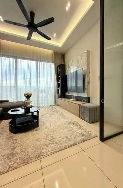Living features: 5-blade ceiling fan with integrated LED light, floor-to-ceiling windows with sheer curtains, light grey wall with marble accent panel, wall-mounted TV, light wood TV console, dark circular coffee table, beige area rug with subtle pattern, grey sectional sofa, decorative vase with flowers, recessed lighting, cream painted walls, large balcony door; style: modern; view: city.