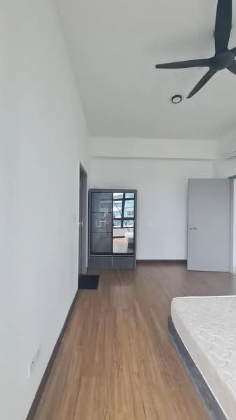 Room features: white painted walls, wooden flooring, 5-blade ceiling fan, sliding mirror wardrobe, door leading to another room, large window with city view, empty space for additional furniture, neutral color scheme; style: modern; view: city.