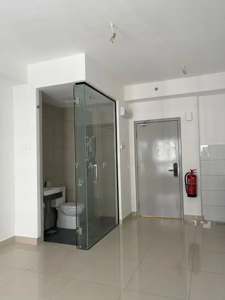 Bathroom features: glass shower enclosure, white toilet, white sink with cabinet, grey tiled walls, cream tiled flooring, recessed ceiling lights, fire extinguisher on wall, door with metallic finish; style: modern. Room features: plain white walls, cream tiled flooring, recessed ceiling lights.