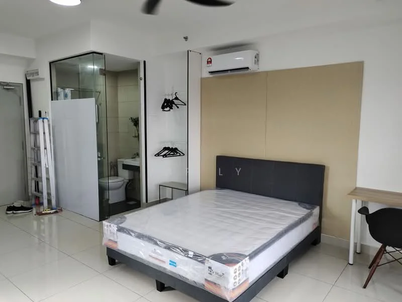 Bedroom features: king-size bed with mattress, white bed linens, wall-mounted air conditioning unit, floor-to-ceiling glass partition, en-suite bathroom with glass door, white tiled flooring, built-in wardrobe with hangers, study desk with chair, decorative wall panel, ceiling fan; style: modern.