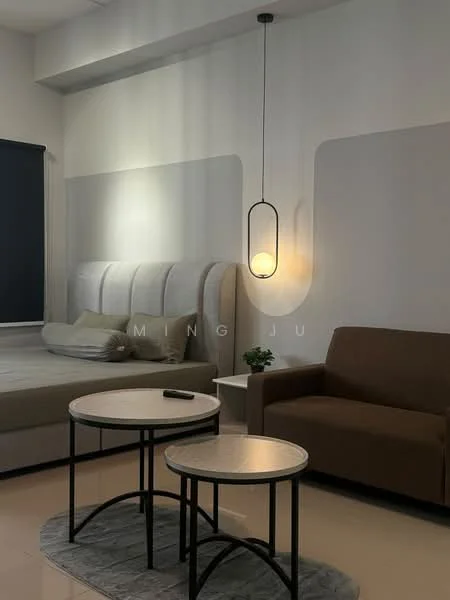 Room features: upholstered headboard, queen-size bed, bedside table, 2 round coffee tables, fabric sofa in brown, pendant light fixture, grey area rug, white painted walls, floor-to-ceiling window with dark blinds, laminate flooring; style: modern.