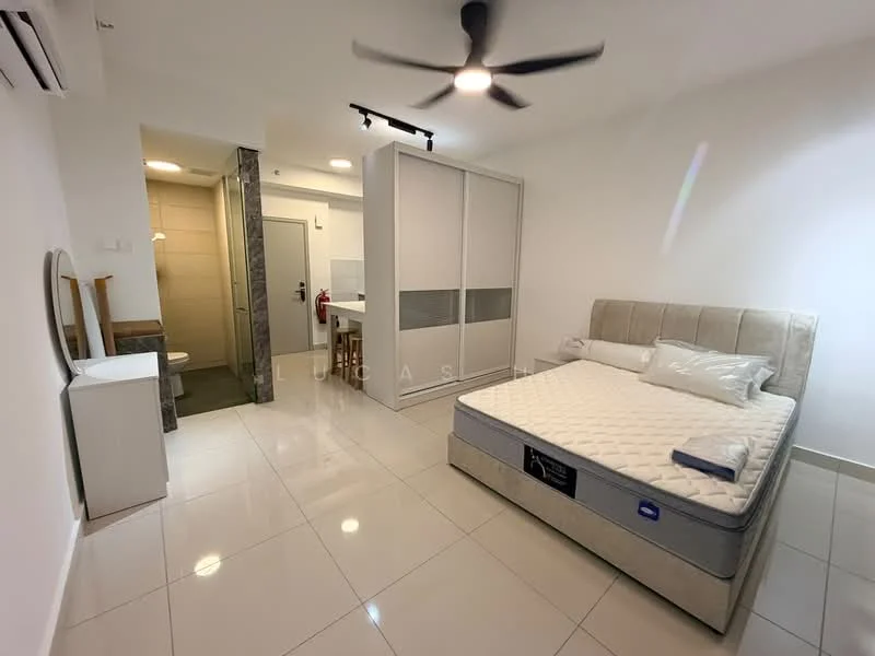 Bedroom features: king-size bed, upholstered headboard, white bedding, 5-blade ceiling fan with light, white painted walls, glossy tile flooring, built-in wardrobe with sliding doors, wall-mounted mirror, small side table, fire extinguisher, open doorway to bathroom, kitchenette area visible; style: modern.