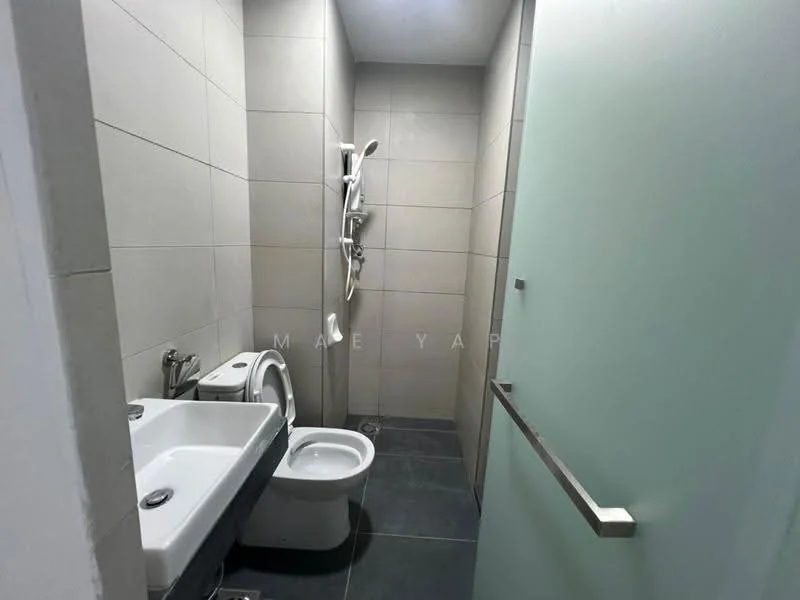 Bathroom features: grey tiled walls, dark grey tiled flooring, single-sink vanity, chrome basin mixer faucet, one-piece toilet, shower with handheld showerhead, glass shower enclosure, mirror above sink; style: modern.