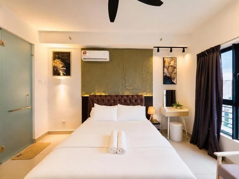 Bedroom features: queen-size bed with white bedding, upholstered headboard in brown, 2 white towels on bed, nightstand with lamp, wall-mounted artwork, green accent wall, floor-to-ceiling window with city view, blackout curtains, 1 wall-mounted split AC, ceiling fan, light fixture above bed, tile flooring; style: modern; view: city.
