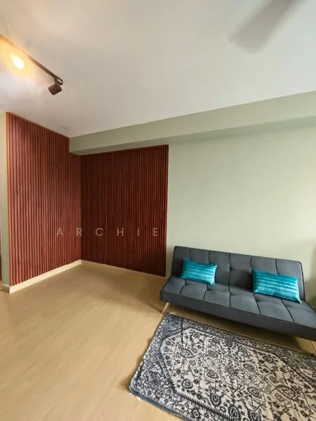 Living features: grey fabric sofa, two teal accent cushions, wood panel accent wall in red, light green painted walls, laminate flooring, area rug with intricate pattern, track lighting, ceiling fan; style: modern.