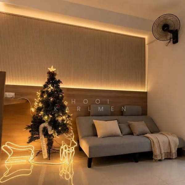 Living features: grey fabric sofa, decorative throw pillows, wood accent wall, recessed LED lighting, floor-to-ceiling windows, decorative Christmas tree with lights, illuminated wire reindeer decorations, polished tile flooring, wall-mounted ceiling fan, beige knitted throw blanket; style: modern.