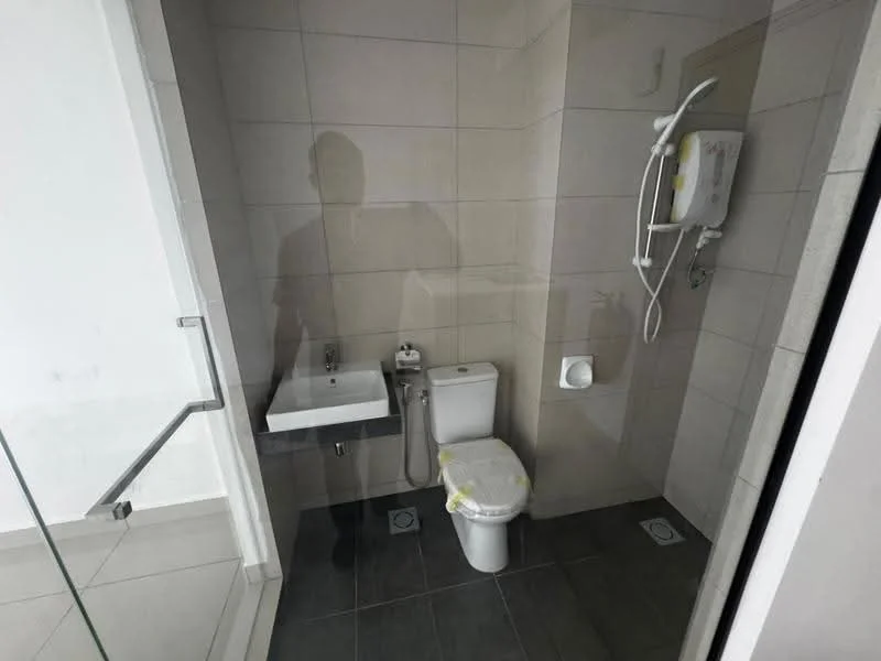 Bathroom features: white tiled walls, grey tiled flooring, single-sink vanity with wall-mounted faucet, one-piece toilet, shower area with glass enclosure, handheld shower, water heater, mirror above sink; style: modern.