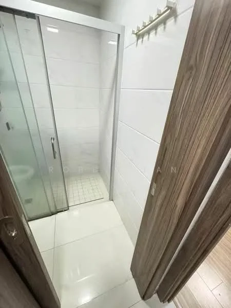Bathroom features: glass shower enclosure, white tiled walls, white tiled flooring, chrome shower head, built-in shower shelf, sliding glass door, wall-mounted towel rack, light fixture, wooden door; style: modern.