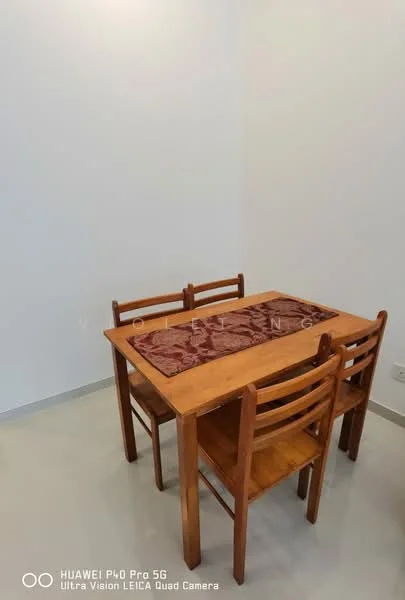 Dining features: wooden dining table, 4 wooden dining chairs, table runner, plain white walls, grey tile flooring; style: minimalist.