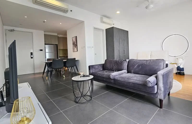 Living features: 3-seater fabric sofa in grey, round coffee table with black metal base, wall-mounted TV, TV console, ceiling fan, recessed downlights, large window with natural light, decorative mirror, grey tiled flooring, white walls, wooden flooring in adjacent area; style: modern. Dining features: 4-seater dining table, black dining chairs, open kitchen layout, kitchen island, stainless-steel fridge; style: modern.