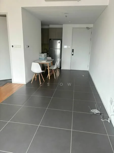 Dining features: grey ceramic tile flooring, white walls, round dining table, 4 white dining chairs, refrigerator, kitchen cabinetry visible in background, door leading to hallway, light fixture on ceiling; style: modern.