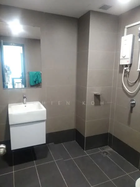 Bathroom features: wall-mounted sink with chrome faucet, mirror above sink, shower area with handheld shower, wall-mounted water heater, grey tiled walls, dark grey floor tiles, glass window, towel hanging on hook; style: modern.