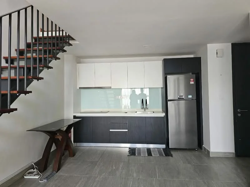 Kitchen features: white upper cabinets, dark wood lower cabinets, light-colored countertop, stainless-steel fridge, single-bowl stainless-steel sink, chrome pull-down faucet, glass backsplash, grey tile flooring, open shelving, stainless-steel appliances; style: modern. Room features: staircase with wooden steps and metal railing, white walls, recessed ceiling lights, large window with natural light.