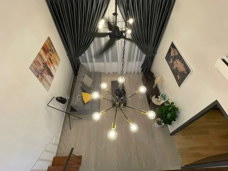 Living features: chandelier with multiple bulbs, 5-blade ceiling fan, grey fabric sofa, decorative wall art, floor lamp, potted plant, curtains in dark grey, wooden staircase, tile flooring, white walls; style: modern.