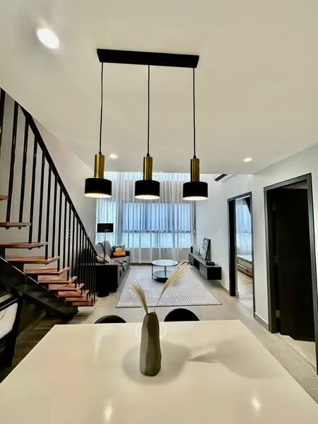 Living features: 3 pendant lights with black shades, wooden staircase with black railing, light grey area rug, black TV console, wall-mounted TV, large windows with sheer curtains, light wood flooring, white walls, black coffee table, decorative vase on table; style: modern.