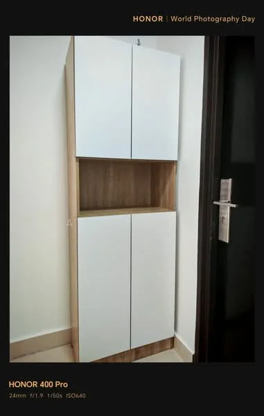 Room features: white cabinetry, wooden shelving, two upper cabinets with doors, two lower cabinets with doors, neutral wall color, light-colored flooring, metal door handle; style: modern.