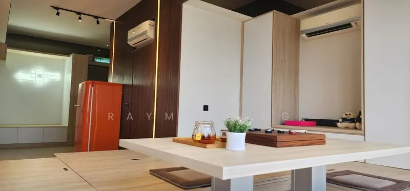 Living features: light wood flooring, white walls, recessed downlights, wall-mounted split AC, orange fridge, built-in cabinetry, wood panel accent wall, dining table with built-in seating, decorative plant, board game on table, teddy bear on shelf; style: modern.