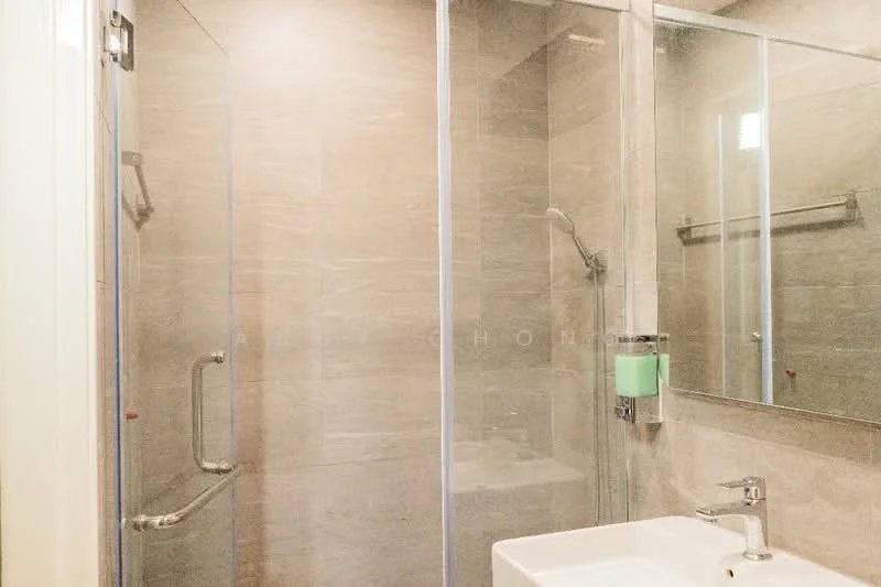 Bathroom features: glass shower enclosure, rain shower head, handheld shower, single-sink vanity, white ceramic sink, chrome basin mixer, tile cladding on walls, grey tile flooring, wall-mounted towel rack, mirror above sink; style: modern.