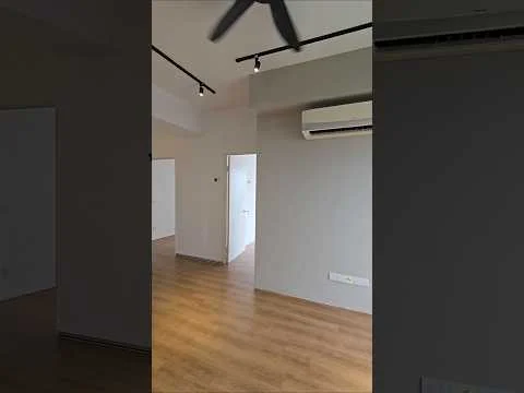 Room features: light wood laminate flooring, grey painted walls, recessed LED downlights, 1 wall-mounted split AC, ceiling fan, white doors, open layout, track lighting; style: modern.