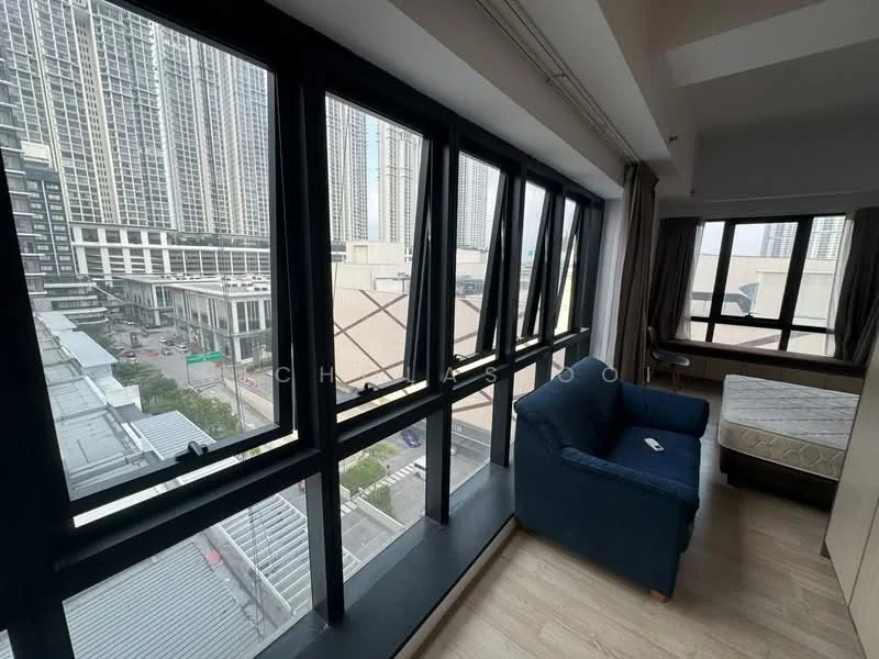 Room features: floor-to-ceiling windows, city view, wooden flooring, blue fabric sofa, bed frame without mattress, curtains, neutral wall color, natural light; style: modern; view: city.