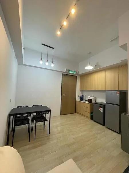Kitchen features: light wood cabinetry, stainless-steel fridge, built-in countertop, 4-seater dining table, black metal dining chairs, white walls, wooden flooring, recessed ceiling lights, pendant lighting, sink, kettle, microwave; style: modern.