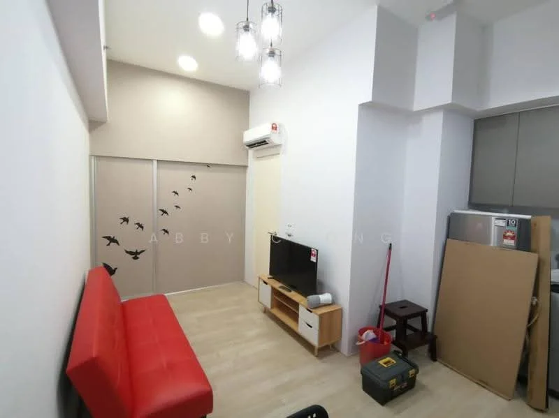 Living features: red leather sofa, wall-mounted TV, wooden TV console, light wood flooring, white painted walls, ceiling light fixture with multiple bulbs, wall-mounted air conditioning unit, decorative wall decals of birds, sliding door with frosted glass, storage boxes, vacuum cleaner, cardboard box; style: modern.