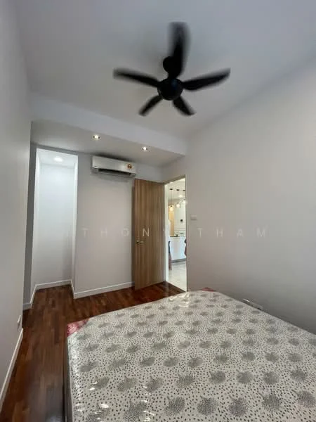 Bedroom features: wooden flooring, white painted walls, 5-blade ceiling fan, wall-mounted split AC, door with wood finish, bed with patterned bedding, recessed lighting, window with natural light; style: modern.