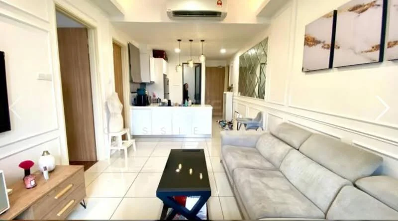 Living features: grey fabric sofa, black coffee table, wall-mounted TV, white painted walls with crown moulding, recessed downlights, tile flooring, air conditioning unit, decorative wall art, wooden door, open layout to kitchen, side table with lamp; style: modern. Kitchen features: white cabinetry, stainless-steel appliances, kitchen island, black countertop, open shelving, tile backsplash, recessed lighting; style: modern.