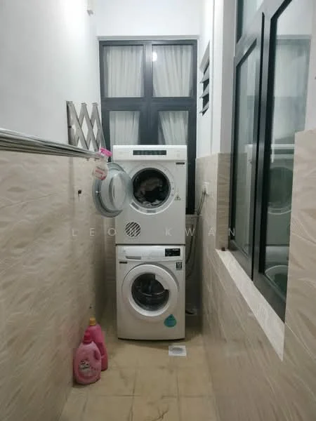 Laundry features: front-load washing machine, tumble dryer, beige tiled walls, light beige floor tiles, window with black frames, clothes drying rack, pink laundry detergent bottle.