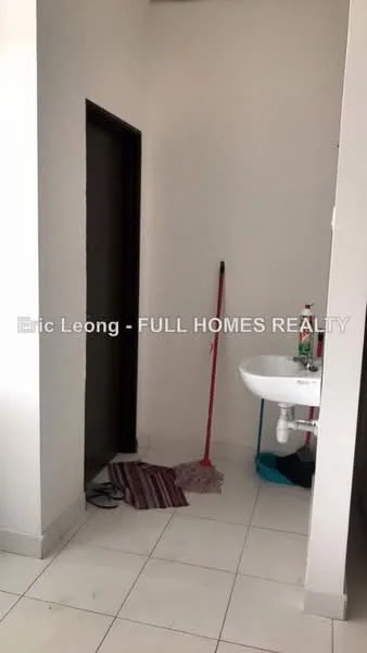 Room features: white painted walls, white tiled flooring, single-bowl sink, wall-mounted faucet, cleaning mop, floor mat, doorway leading to another room.