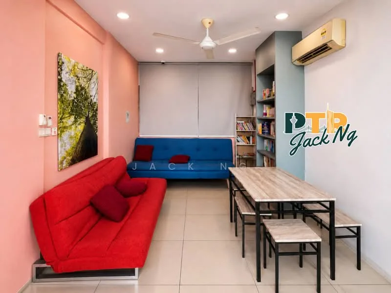 Living features: red fabric sofa with cushions, blue fabric sofa, light wood dining table, four light wood dining chairs, ceiling fan, wall-mounted air conditioning unit, bookshelf with books, light-colored tiled flooring, pink accent wall, grey wall with window coverings; style: modern.