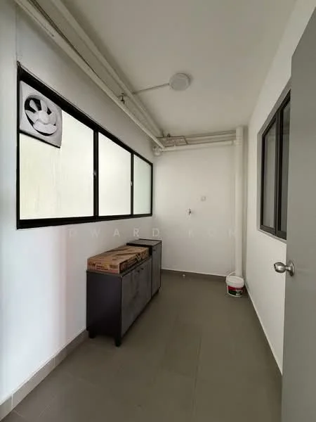 Room features: white painted walls, grey tile flooring, large windows with black frames, ceiling light, door with silver handle, storage cabinet, paint bucket on the floor; style: modern.