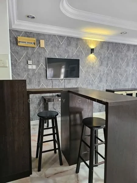 Room features: grey accent wall, marble tile flooring, wooden bar counter, two high stools, wall-mounted TV, recessed lighting, decorative wall sconce, crown moulding; style: modern.