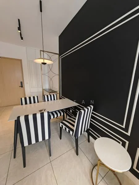 Dining features: striped upholstered dining chairs, marble dining table, black accent wall with geometric design, white tiled flooring, pendant light fixture, gold accent side table, wall paneling, doorway to hallway; style: modern.