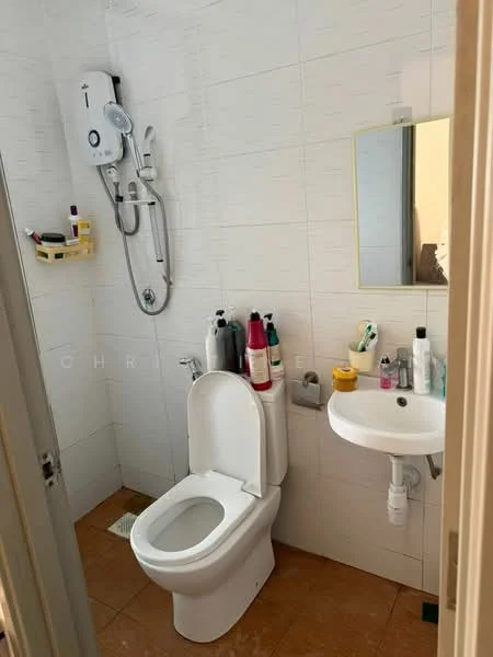 Bathroom features: white tiled walls, brown ceramic tile flooring, one-piece toilet, wall-mounted basin, framed mirror, shower with wall-mounted water heater, various toiletries on shelves, toiletries on sink.