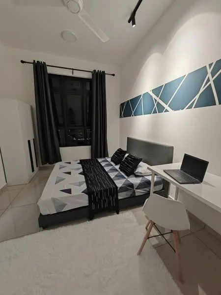 Bedroom features: queen-size bed with geometric patterned bedding, black throw blanket, white desk with laptop, white chair, black curtains, floor-to-ceiling window, decorative wall with blue and white geometric design, light-colored rug, ceiling fan with light, built-in wardrobe; style: modern; view: city.