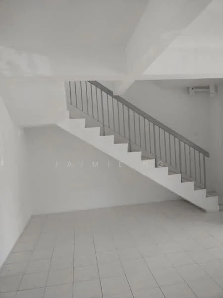 Room features: white painted walls, tile flooring, staircase with metal railing, open space, high ceiling, natural light from windows, no visible furniture, minimalist design; style: modern.