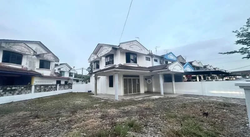 Exterior type: semi-detached house; features: two-storey structure, white painted facade, gabled roof, front porch area, exposed brick wall, fenced yard, concrete driveway, visible air conditioning unit, surrounding greenery, adjacent houses, open space in front; style: traditional.