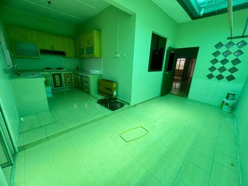 Kitchen features: green painted walls, tile flooring, kitchen cabinets in light green, countertop, stainless-steel sink, built-in stove, exhaust hood, window, doorway leading to another room, light fixture, wall-mounted storage, open layout to adjacent room. Room features: tile flooring, doorway leading to another room, window, light fixture.