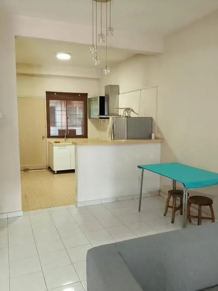 Kitchen features: white tiled flooring, light grey walls, kitchen island with countertop, stainless-steel fridge, built-in oven, white cabinetry, single-bowl stainless-steel sink, chrome pull-down faucet, window with grid pattern, recessed ceiling lights, pendant light fixture; style: modern. Living features: grey fabric sofa, small blue table, two wooden stools, white walls, tile flooring, ceiling light fixture; style: modern.
