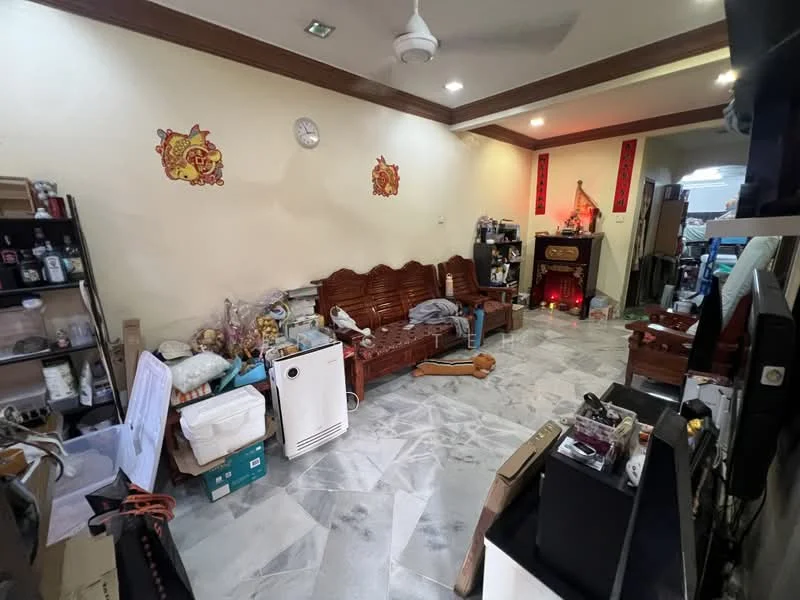 Living features: marble tile flooring, white painted walls, ceiling fan, wooden sofa set, wooden coffee table, wall clock, decorative wall art, air conditioning unit, various boxes and items scattered, open space layout.