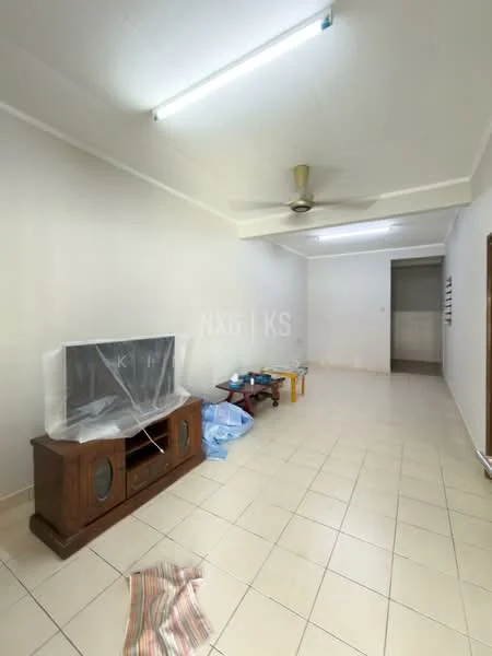 Living features: white painted walls, tiled flooring, ceiling fan, wooden TV console, plastic covering on TV, small coffee table, area rug, light fixture on ceiling.