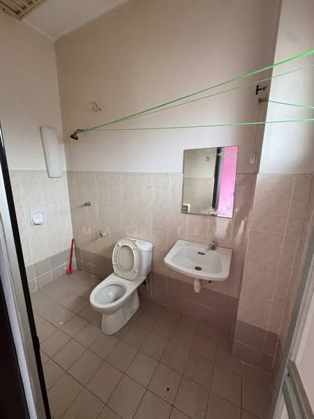 Bathroom features: white ceramic toilet, white sink, mirror above sink, tiled walls in light beige, tiled flooring in light beige, clothes drying line, wall-mounted soap dish, single faucet.