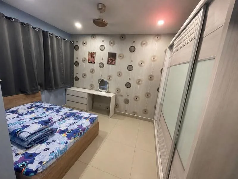 Bedroom features: queen-size bed with blue floral bedding, wooden bed frame, built-in wardrobe with sliding doors, white desk with mirror, grey curtains, decorative wall with floral pattern, recessed ceiling lights, tile flooring; style: modern.