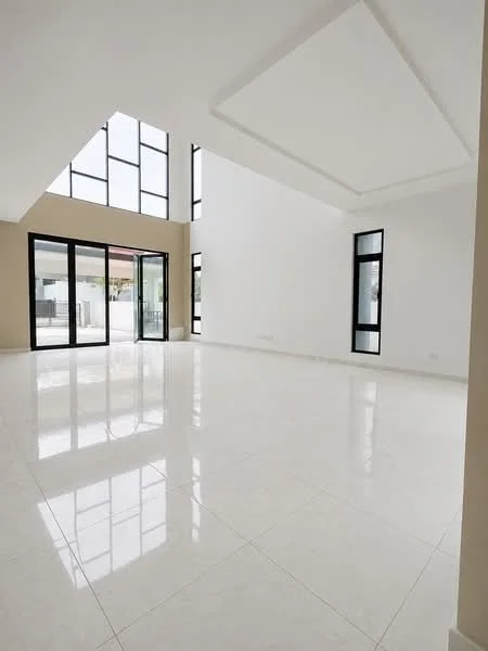 Room features: white painted walls, high ceiling with tray ceiling, large floor-to-ceiling windows, glossy white tile flooring, natural light from multiple windows, open layout, minimalist design, neutral color palette; style: modern; view: garden.