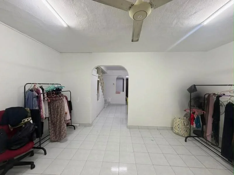 Room features: white painted walls, white tiled flooring, ceiling fan, arched doorway, clothing racks, red upholstered chair, natural light from windows, neutral decor; style: minimalist.